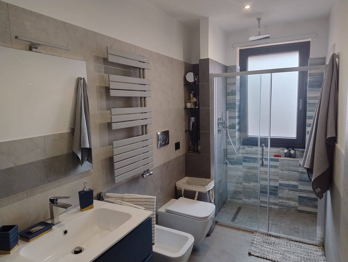 Bathroom with walk-in shower and heated towel rail
