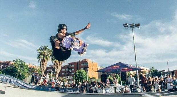 A skateboarder in the air during a contest at The Spot, Ostia Skate Park